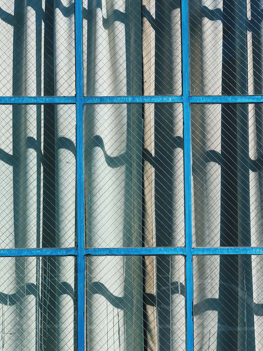 prison gray curtain and brown framed clear glass window during daytime 1151 howard st
